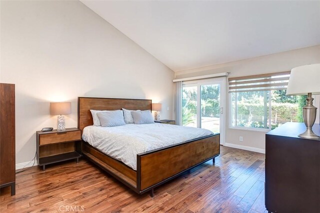 2580 Crown Way, Fullerton, CA 92833 - bedroom with access to exterior, wood finished floors, and vaulted ceiling