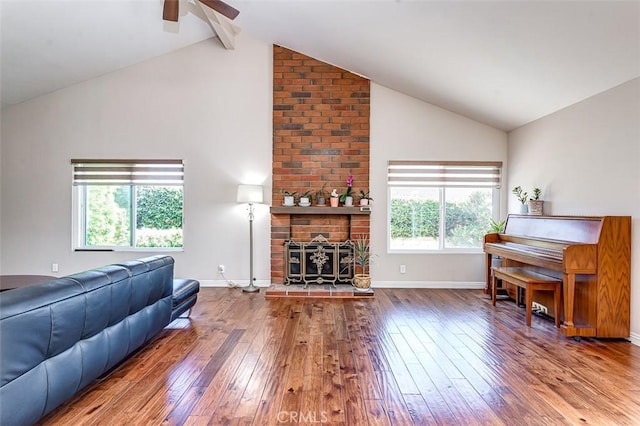 2580 Crown Way, Fullerton, CA 92833 - living area featuring hardwood / wood-style flooring, ceiling fan, a brick fireplace, high vaulted ceiling, and beam ceiling