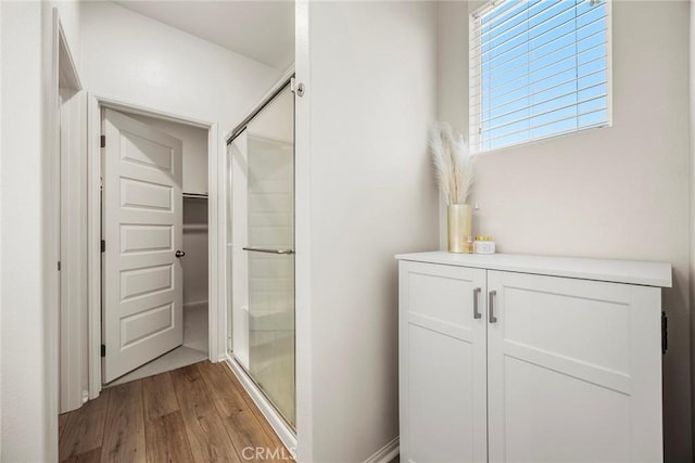 247 Lockhart Way, West Covina, CA 91790 - full bath with wood finished floors, a stall shower, and a spacious closet