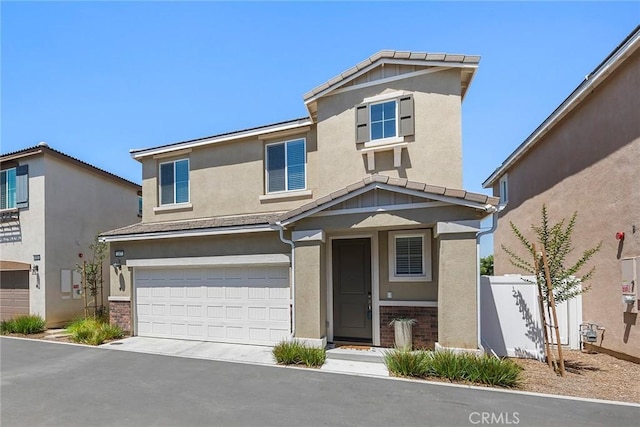247 Lockhart Way, West Covina, CA 91790 - view of front of property with an attached garage, stucco siding, brick siding, and driveway