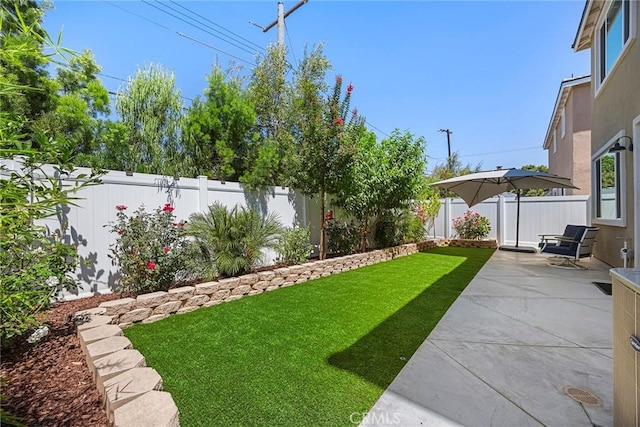 247 Lockhart Way, West Covina, CA 91790 - fenced backyard featuring a patio area
