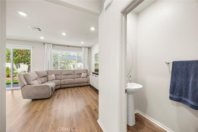 247 Lockhart Way, West Covina, CA 91790 - living room featuring light wood finished floors and recessed lighting