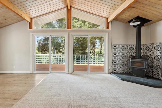 8438 Valley View Trl, Pine Valley, CA 91962 - unfurnished living room with a wood stove, plenty of natural light, wooden ceiling, and wood finished floors