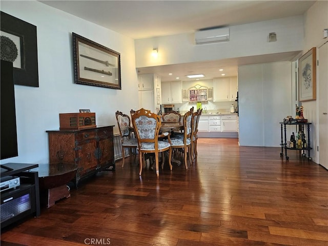 1402 Golden Rain Rd Unit 55G, Seal Beach, CA 90740 - dining room featuring a wall mounted air conditioner and dark wood-style floors