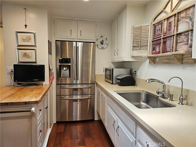 1402 Golden Rain Rd Unit 55G, Seal Beach, CA 90740 - kitchen featuring stainless steel refrigerator with ice dispenser, white cabinets, dark wood-style floors, and butcher block countertops