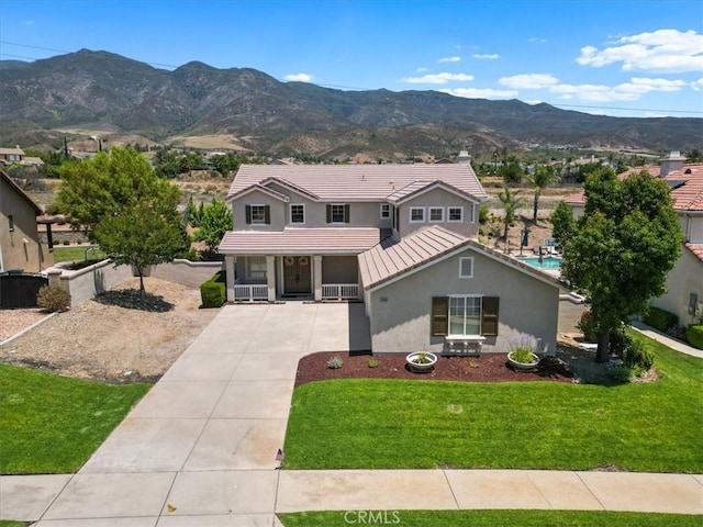 14080 Crestline Pl, Rancho Cucamonga, CA 91739 - traditional-style house with stucco siding, driveway, a porch, a mountain view, and a front lawn