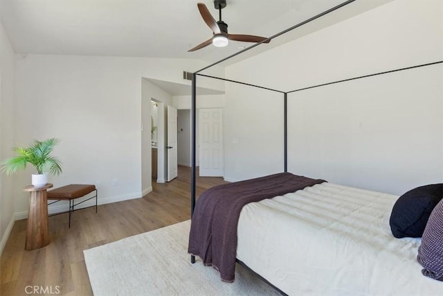 14080 Crestline Pl, Rancho Cucamonga, CA 91739 - bedroom with wood finished floors, vaulted ceiling, a ceiling fan, and a closet