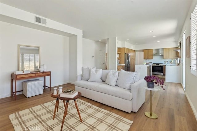 14080 Crestline Pl, Rancho Cucamonga, CA 91739 - living room featuring light wood finished floors, healthy amount of natural light, and recessed lighting