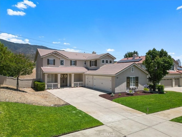 14080 Crestline Pl, Rancho Cucamonga, CA 91739 - traditional-style house with a tile roof, covered porch, stucco siding, and a front lawn