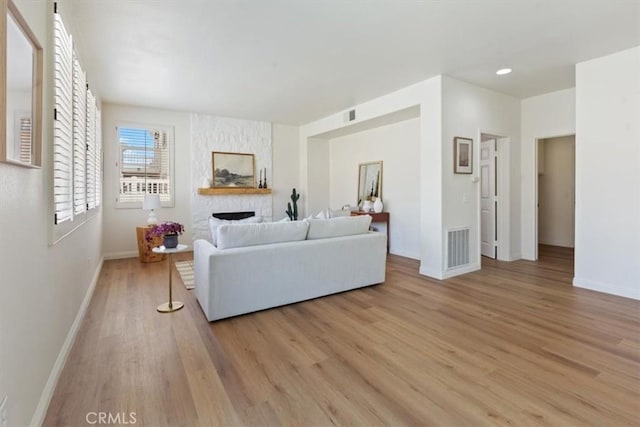 14080 Crestline Pl, Rancho Cucamonga, CA 91739 - living room with a fireplace and light wood-style floors