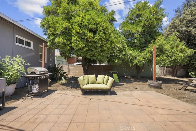 2184 S Towne Ave, Pomona, CA 91766 - fenced backyard featuring a grill and a patio area