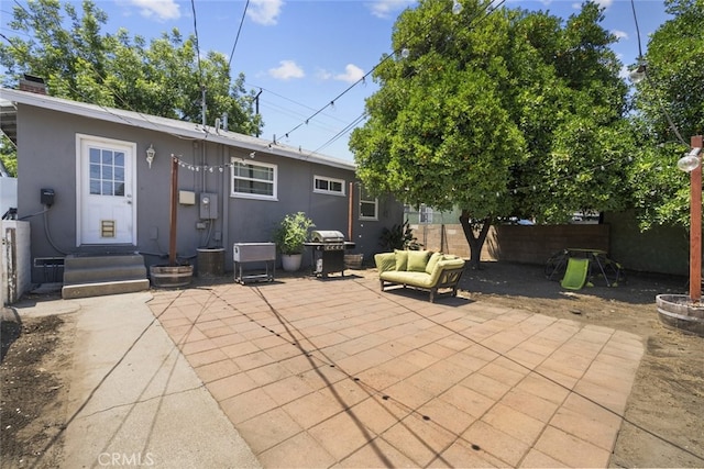 2184 S Towne Ave, Pomona, CA 91766 - back of house with stucco siding, a patio, a fenced backyard, and an outdoor living space