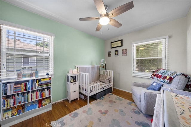 2184 S Towne Ave, Pomona, CA 91766 - bedroom featuring multiple windows, wood finished floors, and ceiling fan