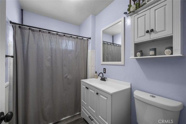 2184 S Towne Ave, Pomona, CA 91766 - full bathroom featuring vanity, wood finished floors, and curtained shower
