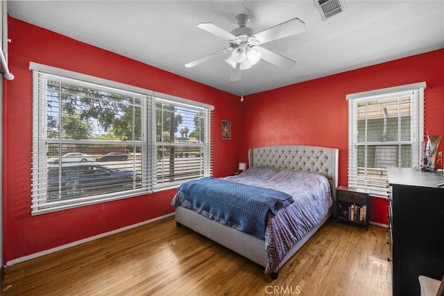 2184 S Towne Ave, Pomona, CA 91766 - bedroom featuring multiple windows, wood-type flooring, and a ceiling fan