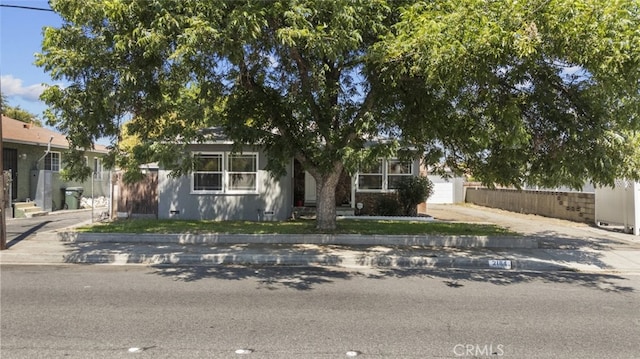 2184 S Towne Ave, Pomona, CA 91766 - view of property hidden behind natural elements with concrete driveway