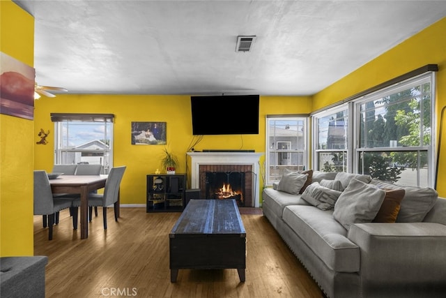 2184 S Towne Ave, Pomona, CA 91766 - living room with wood finished floors, a fireplace, and ceiling fan
