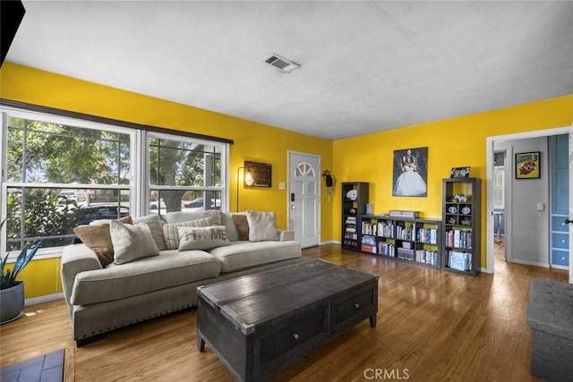 2184 S Towne Ave, Pomona, CA 91766 - living area featuring wood finished floors and plenty of natural light