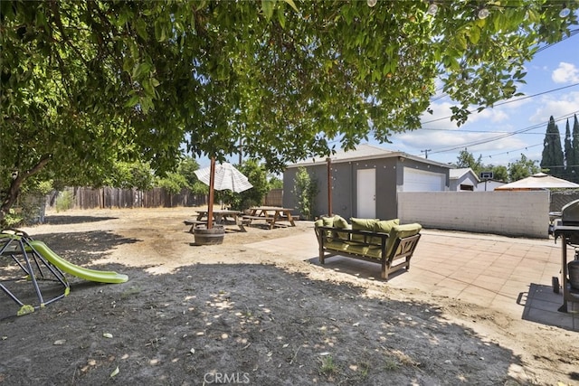 2184 S Towne Ave, Pomona, CA 91766 - fenced yard featuring a patio and an outbuilding
