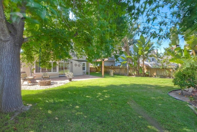 635 Boysenberry Way, Oceanside, CA 92057 - fenced backyard featuring a fire pit, a patio, and an outbuilding