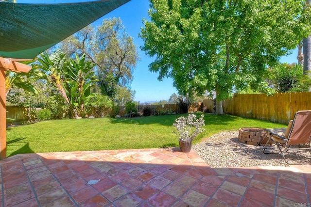 635 Boysenberry Way, Oceanside, CA 92057 - fenced backyard with a fire pit and a patio