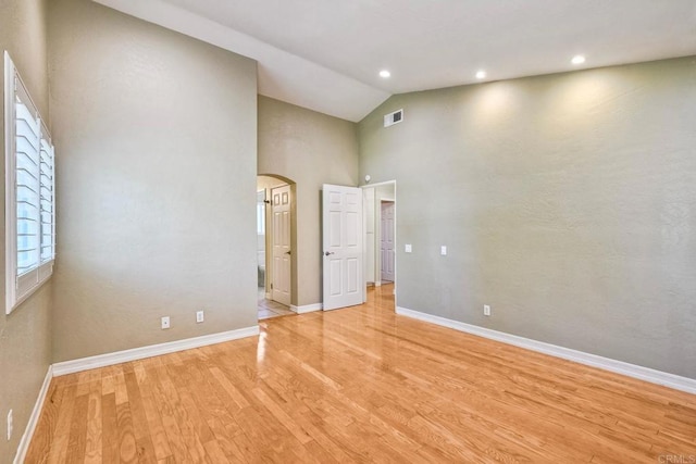 635 Boysenberry Way, Oceanside, CA 92057 - unfurnished bedroom with arched walkways, light wood-type flooring, high vaulted ceiling, and recessed lighting