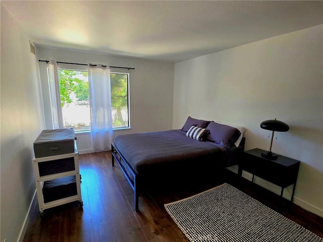 6815 Remmet Ave Unit 217, Canoga Park, CA 91303 - bedroom with dark wood finished floors and baseboards