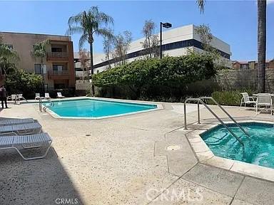 6815 Remmet Ave Unit 217, Canoga Park, CA 91303 - community pool featuring a patio