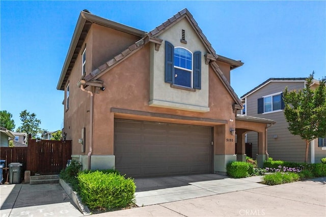 9180 Araujo Ct, Atascadero, CA 93422 - view of front facade with an attached garage, stucco siding, and driveway