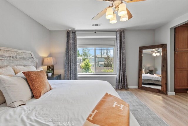 9180 Araujo Ct, Atascadero, CA 93422 - bedroom with light wood-style flooring and a ceiling fan