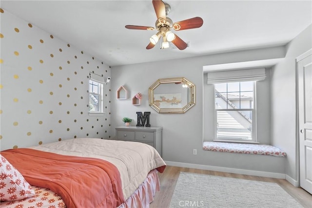 9180 Araujo Ct, Atascadero, CA 93422 - bedroom featuring light wood finished floors, ceiling fan, and wallpapered walls