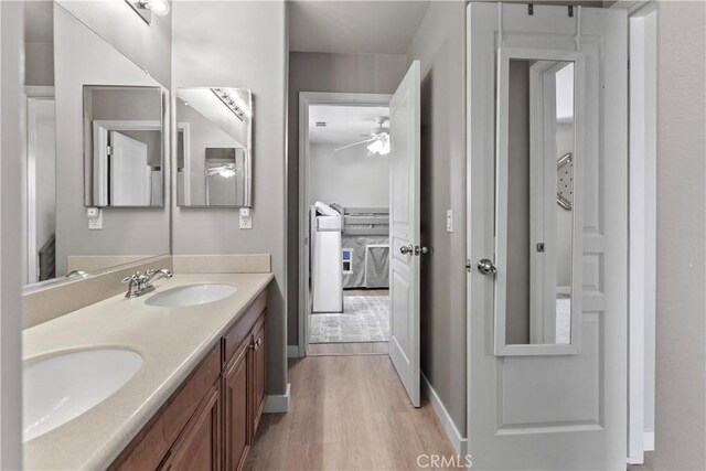9180 Araujo Ct, Atascadero, CA 93422 - ensuite bathroom with a ceiling fan, wood finished floors, and double vanity