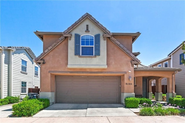9180 Araujo Ct, Atascadero, CA 93422 - view of front of home featuring stucco siding, an attached garage, and concrete driveway