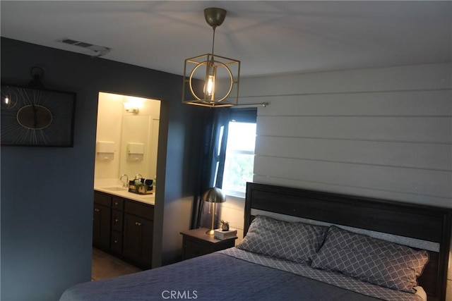 12801 N Watt Ln Unit A, Sylmar, CA 91342 - bedroom featuring a chandelier and connected bathroom