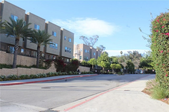 12801 N Watt Ln Unit A, Sylmar, CA 91342 - view of asphalt road featuring sidewalks and curbs