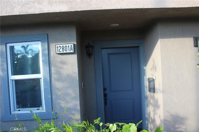 12801 N Watt Ln Unit A, Sylmar, CA 91342 - doorway to property with stucco siding