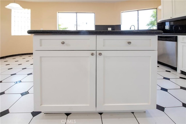 10345 Encino Ave, Granada Hills, CA 91344 - kitchen featuring stainless steel dishwasher, light flooring, and white cabinets