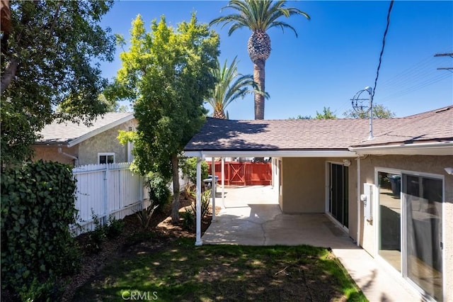 10345 Encino Ave, Granada Hills, CA 91344 - back of house with stucco siding, a patio, and roof with shingles