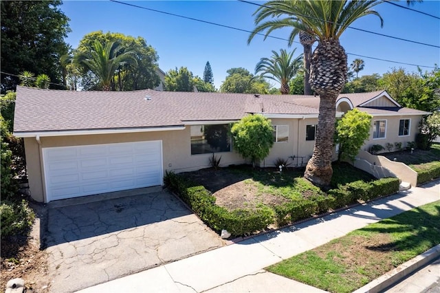10345 Encino Ave, Granada Hills, CA 91344 - ranch-style house with stucco siding, an attached garage, driveway, and a shingled roof