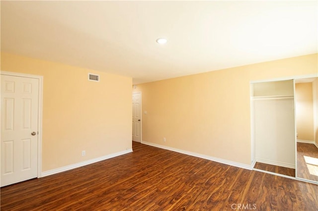 10345 Encino Ave, Granada Hills, CA 91344 - unfurnished bedroom featuring dark wood-type flooring, recessed lighting, and a closet