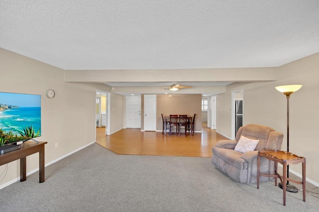 6820 Hyde Park Dr Unit A, San Diego, CA 92119 - carpeted living area with a textured ceiling and baseboards