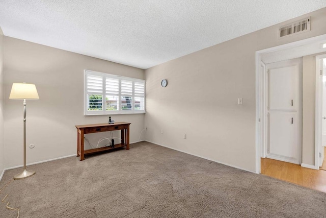 6820 Hyde Park Dr Unit A, San Diego, CA 92119 - carpeted spare room featuring a textured ceiling and baseboards