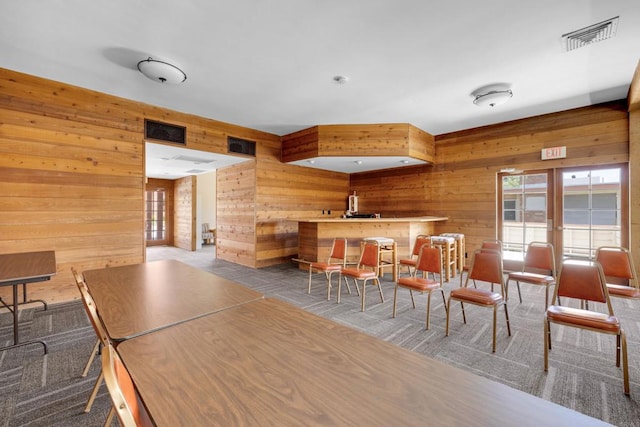 6820 Hyde Park Dr Unit A, San Diego, CA 92119 - carpeted dining area with wooden walls and plenty of natural light