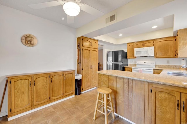 6820 Hyde Park Dr Unit A, San Diego, CA 92119 - kitchen featuring white appliances, a peninsula, a ceiling fan, a kitchen bar, and recessed lighting
