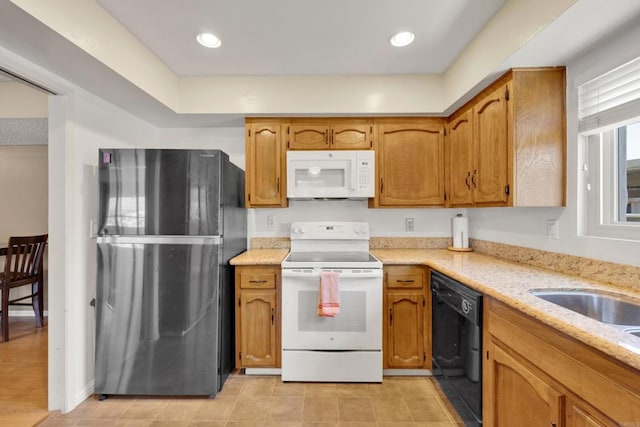 6820 Hyde Park Dr Unit A, San Diego, CA 92119 - kitchen featuring white appliances, light stone countertops, and brown cabinetry