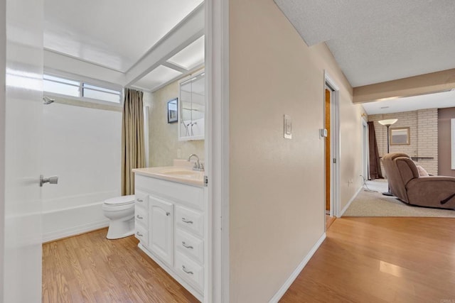 6820 Hyde Park Dr Unit A, San Diego, CA 92119 - full bathroom with wood finished floors, vanity, and shower / bath combination with curtain