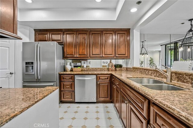 120 The Unit 210, Redondo Beach, CA 90277 - kitchen with stainless steel appliances, light floors, light stone counters, and recessed lighting