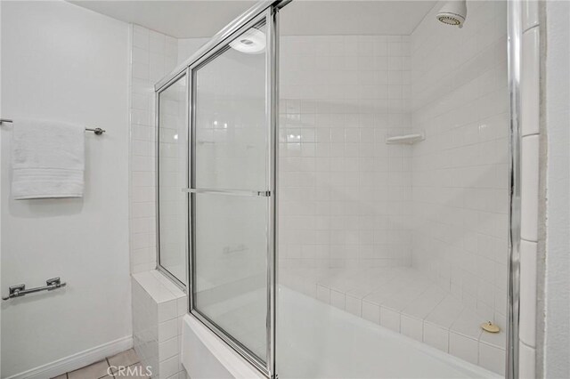120 The Unit 210, Redondo Beach, CA 90277 - full bathroom with shower / bath combination with glass door and baseboards