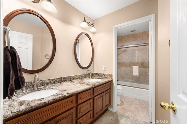 14067 Glendale Ct, Rancho Cucamonga, CA 91739 - bathroom featuring double vanity, enclosed tub / shower combo, and tile patterned flooring