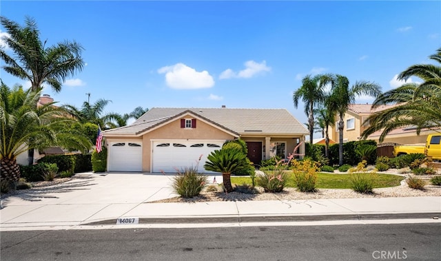 14067 Glendale Ct, Rancho Cucamonga, CA 91739 - view of front of house featuring a garage, stucco siding, driveway, and a tiled roof